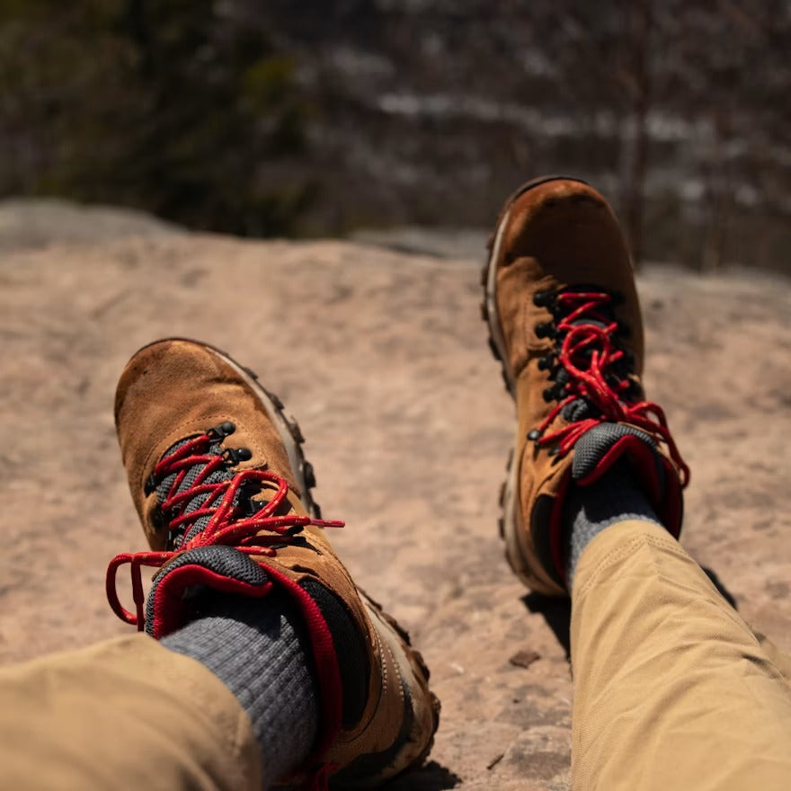 Hiker wearing hiking socks and boots before a trail walk