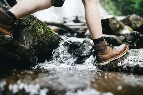 Wet boots prepared for safe indoor drying after rain