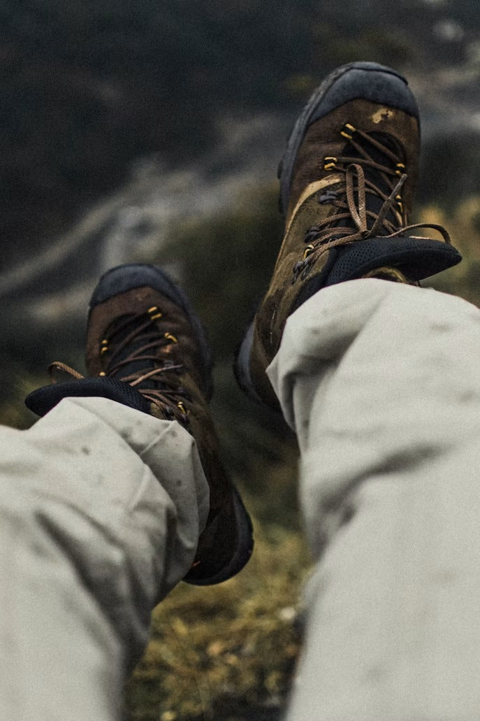 Hiker checking the fit of new hiking boots before hiking