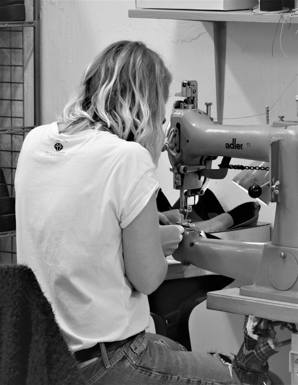Seamstress stitching boots at the Samelin workshop in Estonia